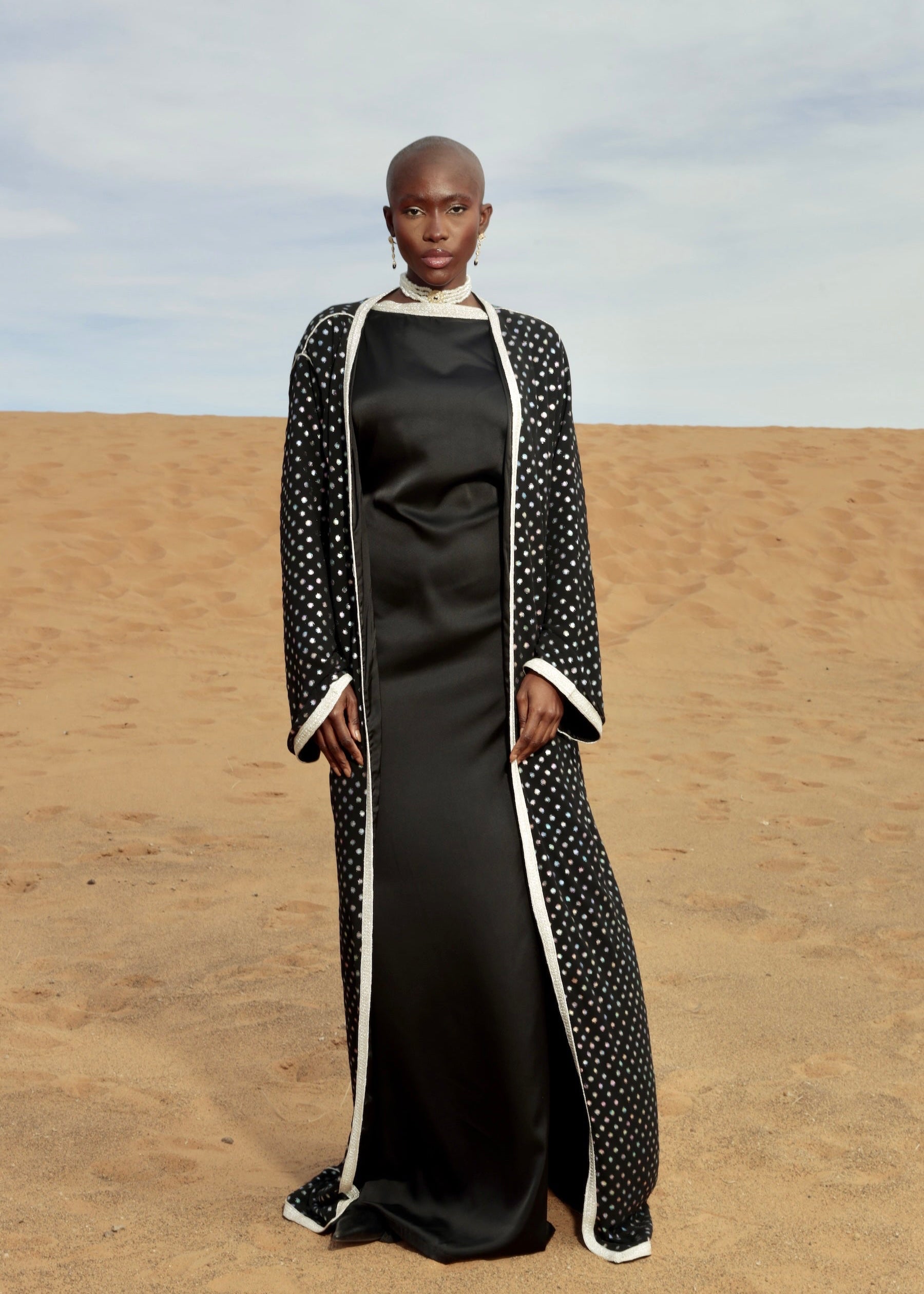 Black tulle abaya kimono embellished with sfifa and sparkling rhinestones, front view.