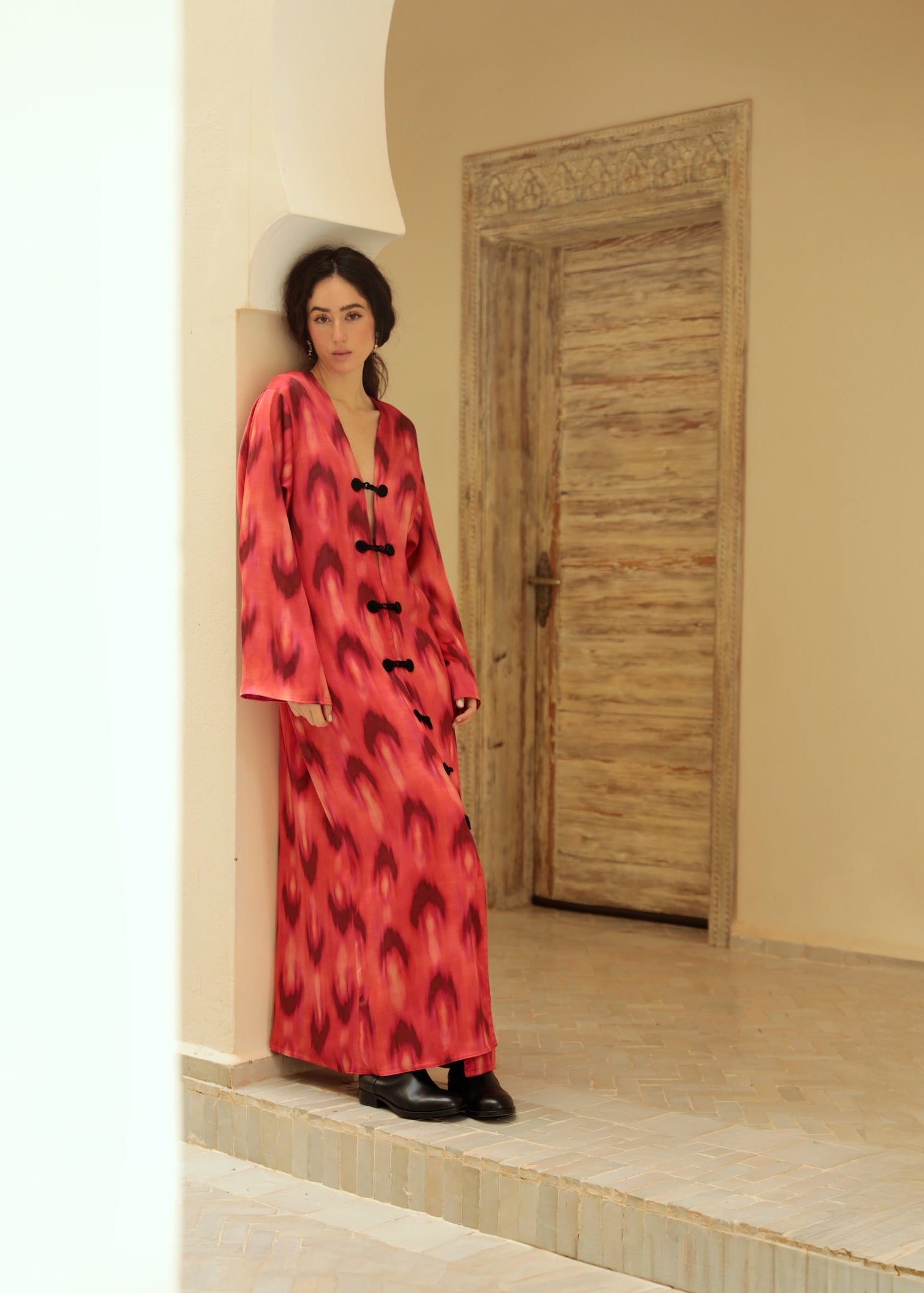 Red and black chiffon dress with crochet detailing, front view.