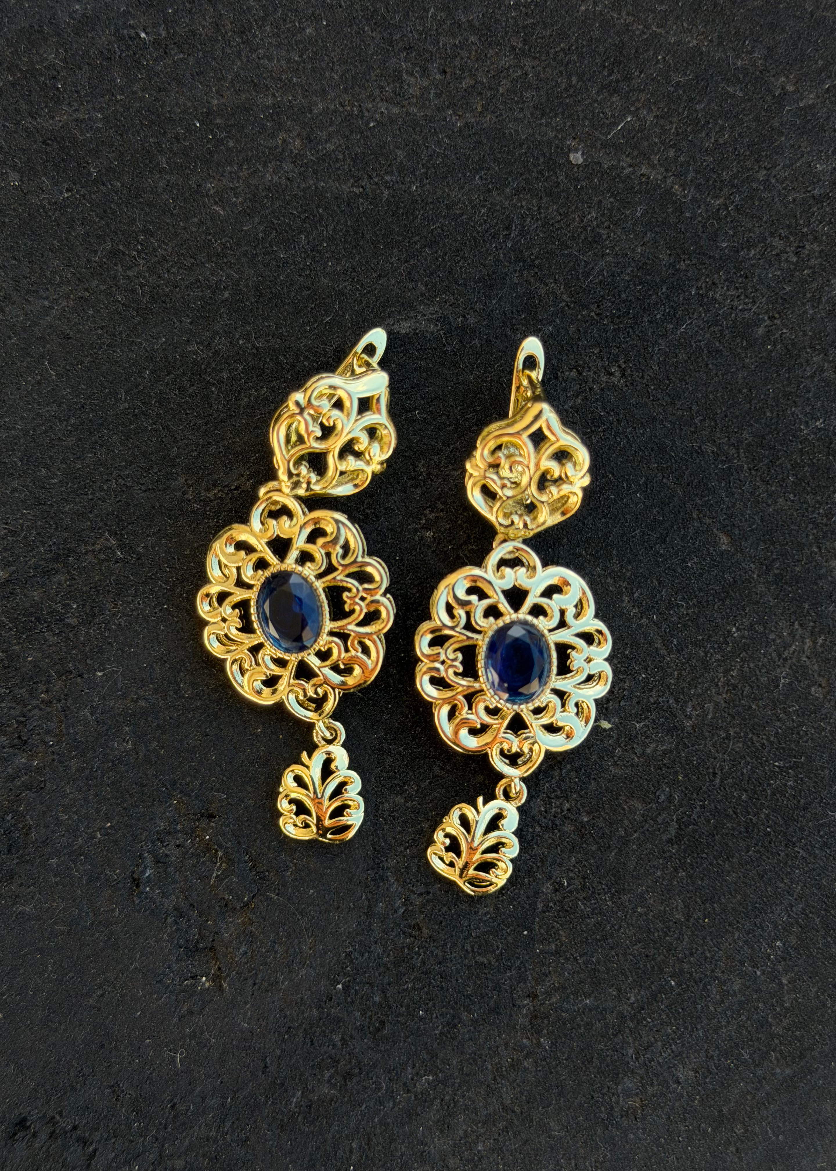 Gold filigree earrings with blue stones, round openwork design, oriental jewelry