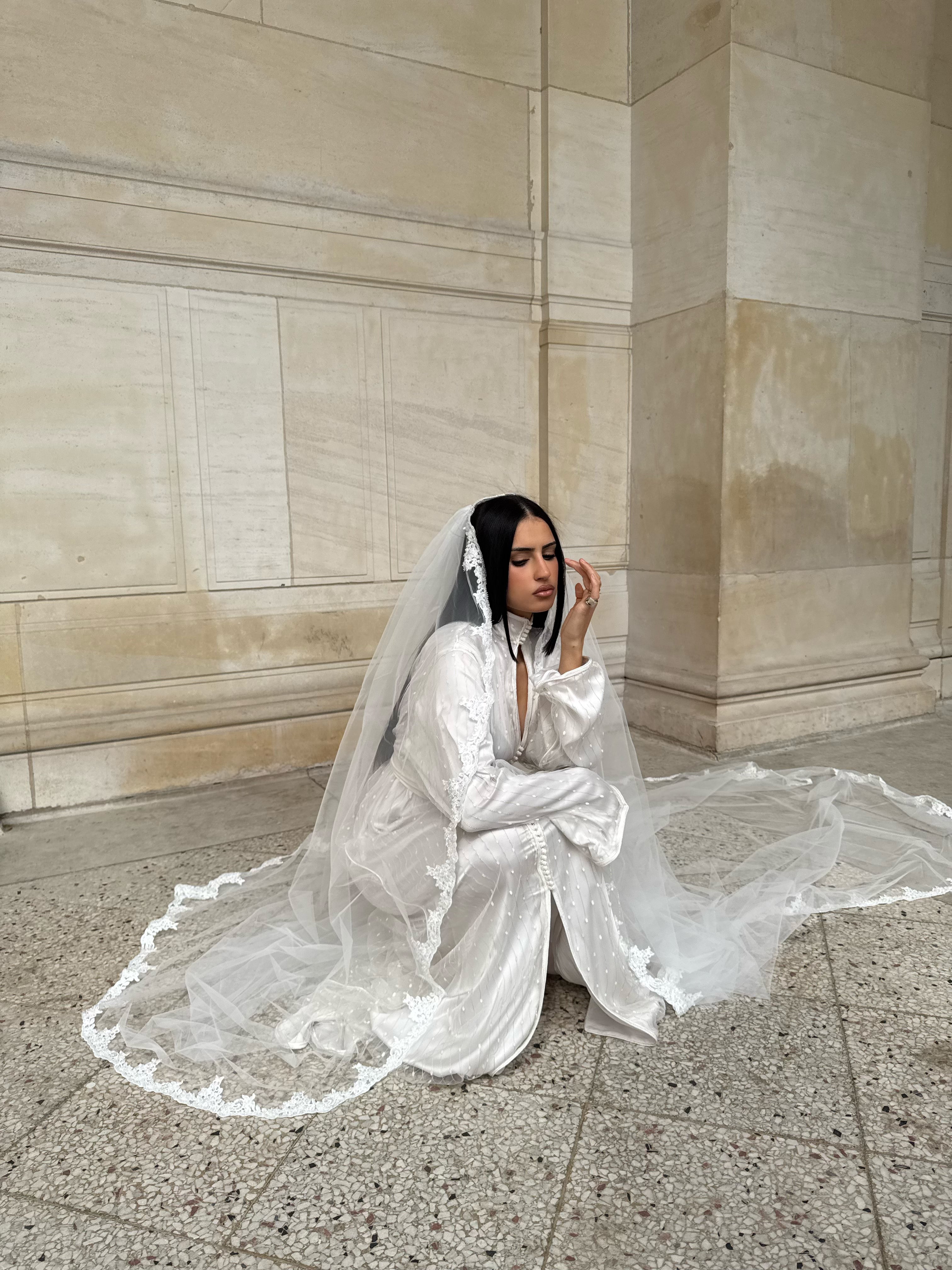 White Kaftan worn while seated, with veil shown separately