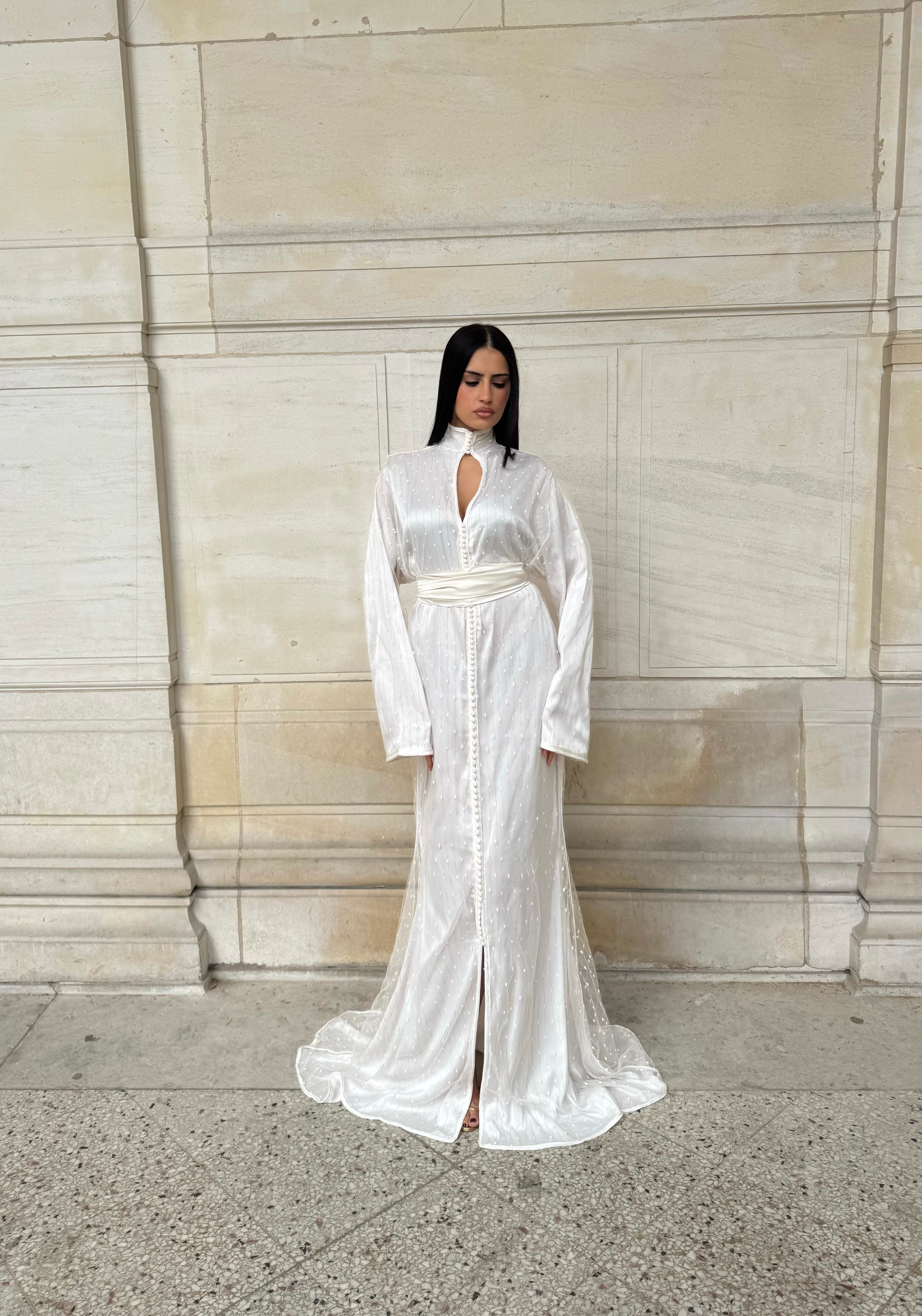 White Kaftan with a high neckline and beaded detailing, viewed from the front