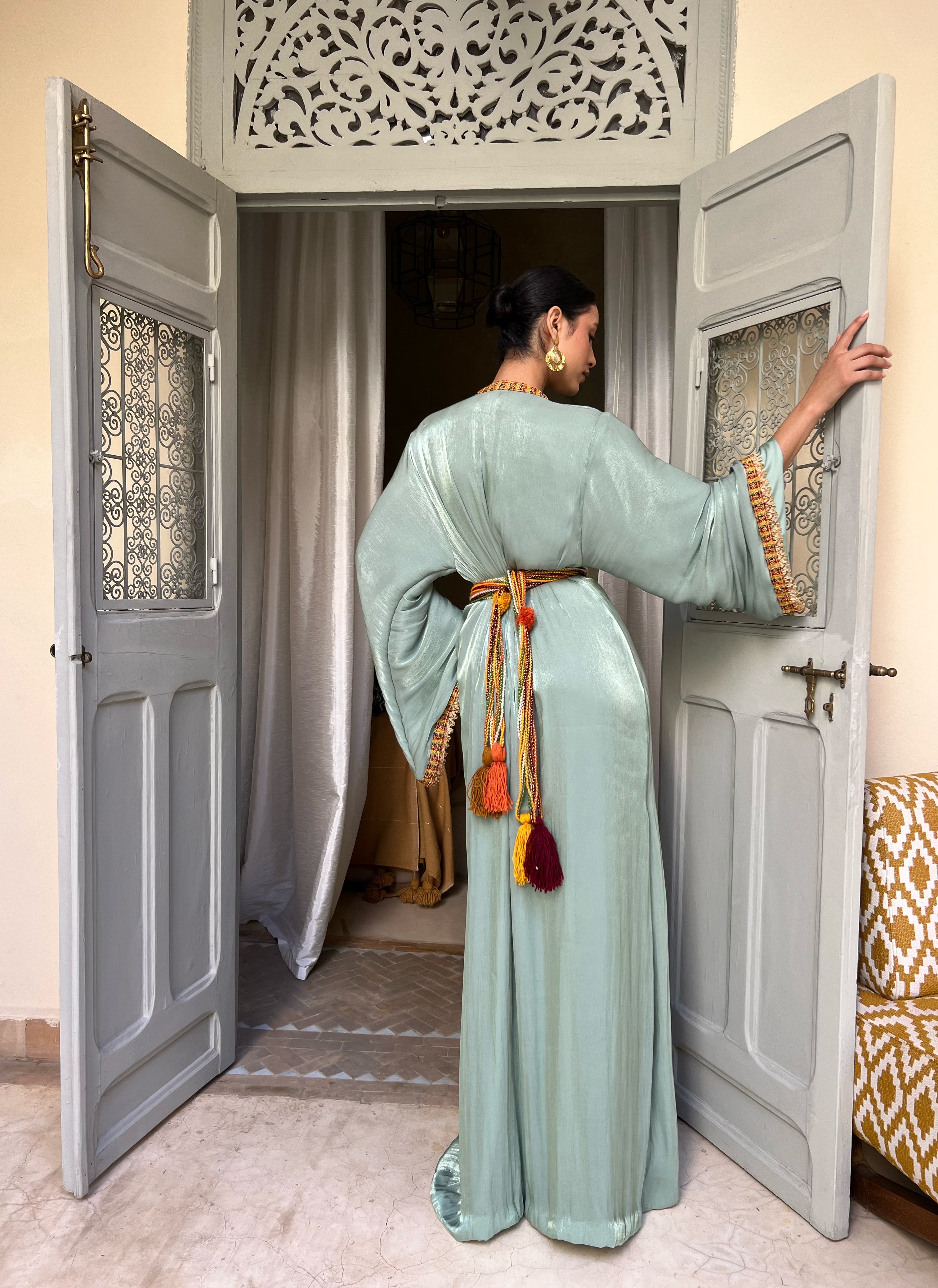Back of the Kabyle Kaftan in light green organza, hand-crafted finishing and Berber belt in coloured wool
