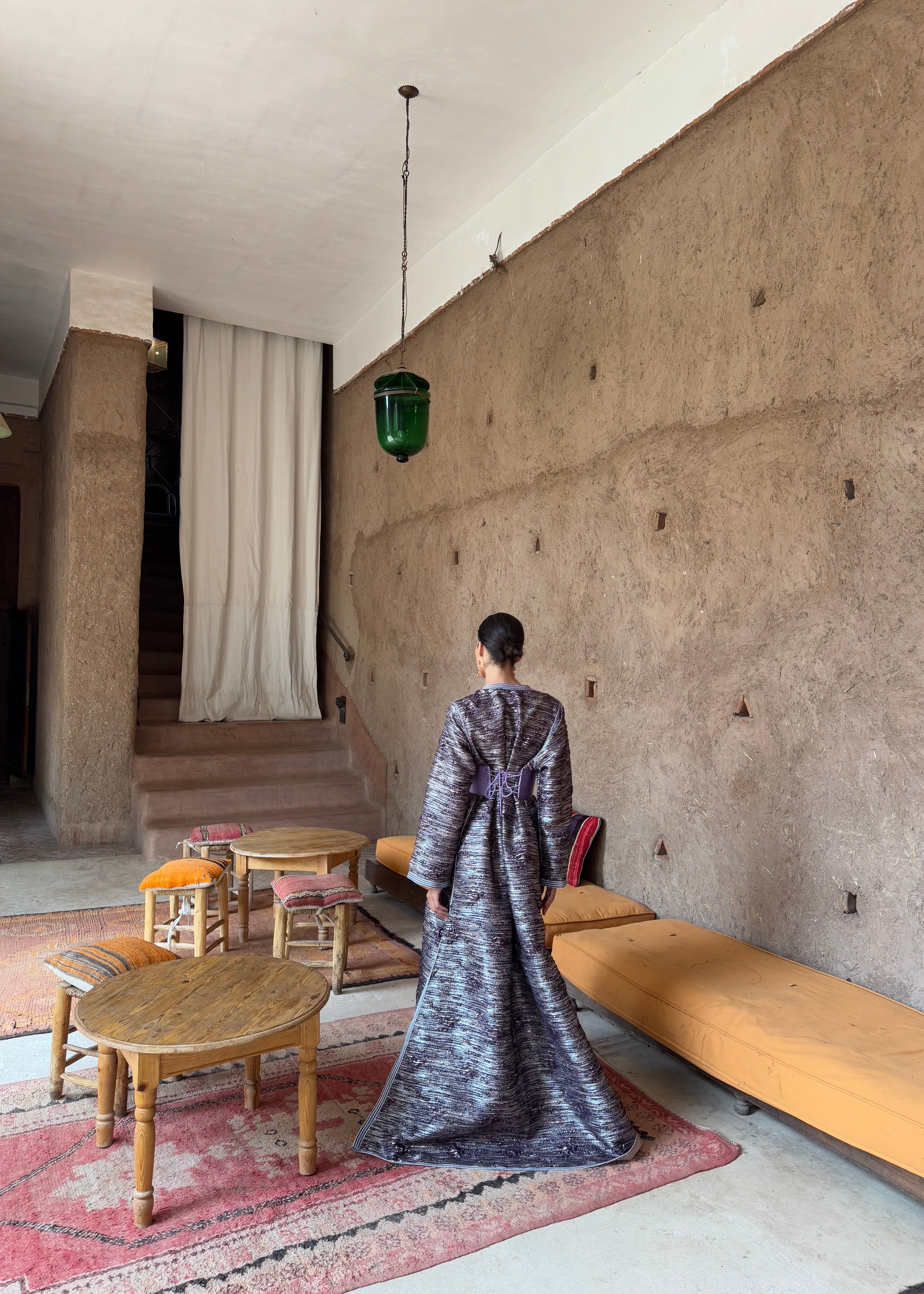 Rear view of the purple brocade Kaftan , highlighting the cut and finishings
