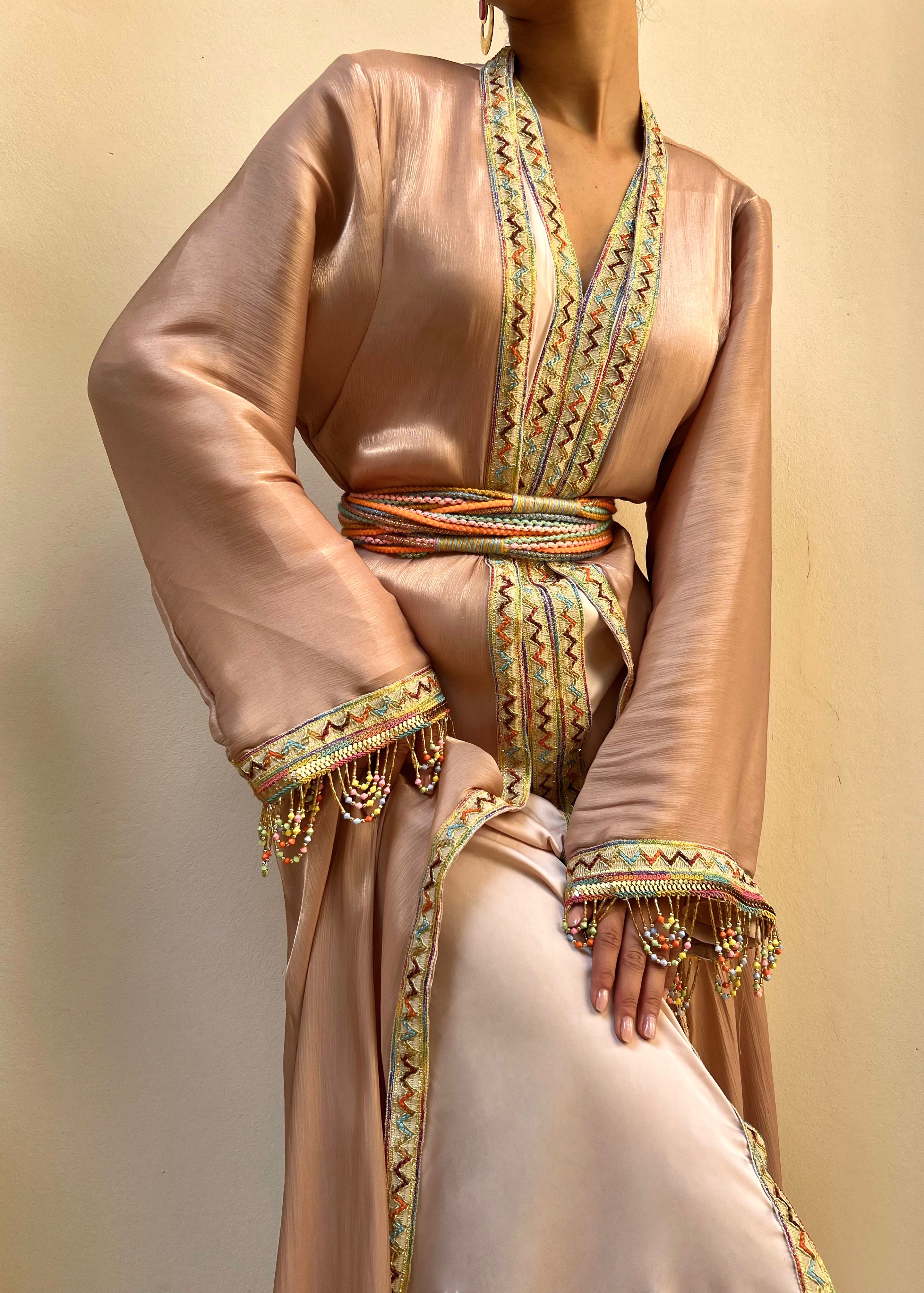 Kabyle Kaftan in embroidered pink organza, with wool belt and beaded sleeves, front view on mannequin