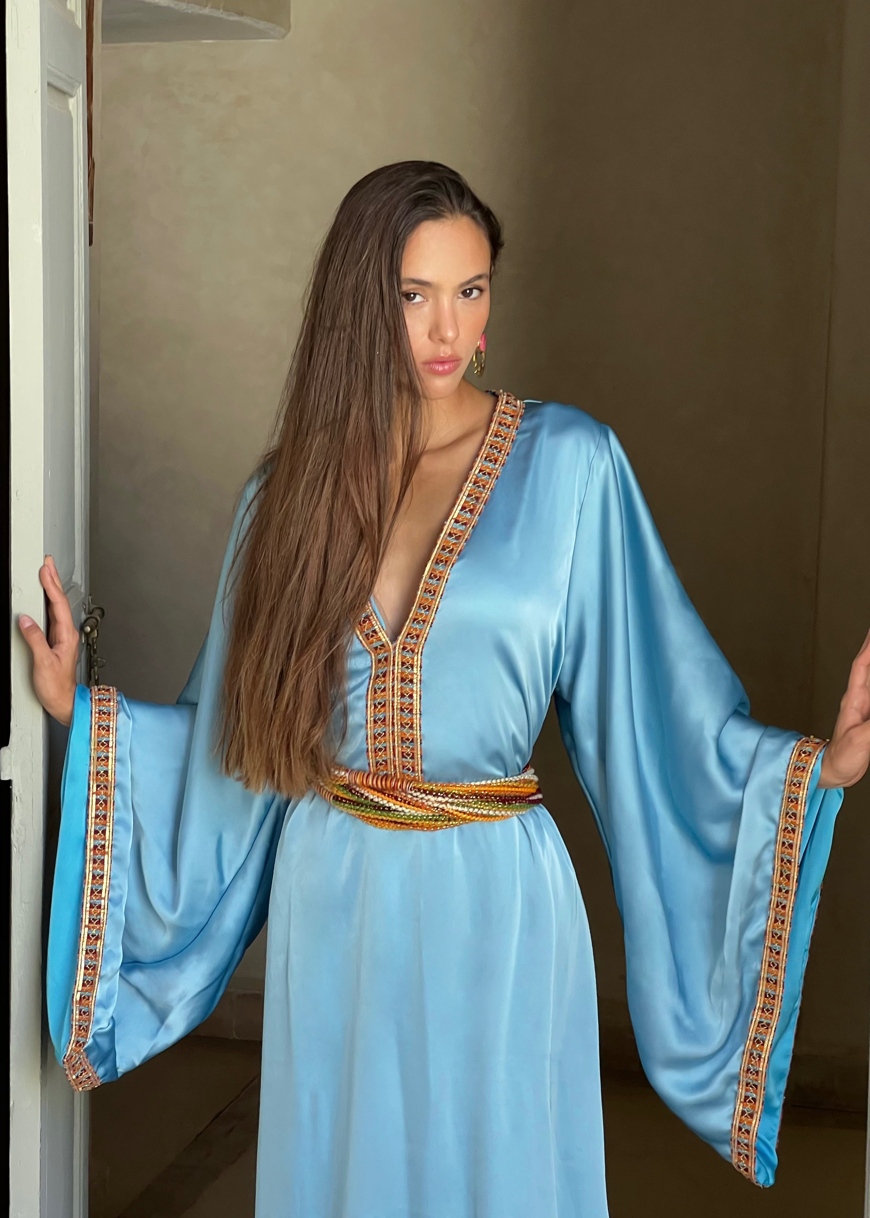 Detail of the blue Kabyle Kaftan in silk cloth, handmade embroidery and traditional Berber finishes