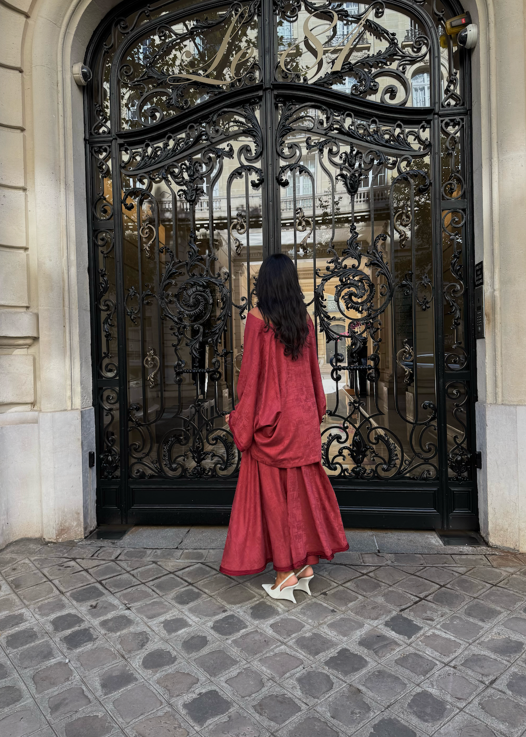 Back of terracotta Mlifa silk ensemble with handcrafted sfifa on blouse and long skirt