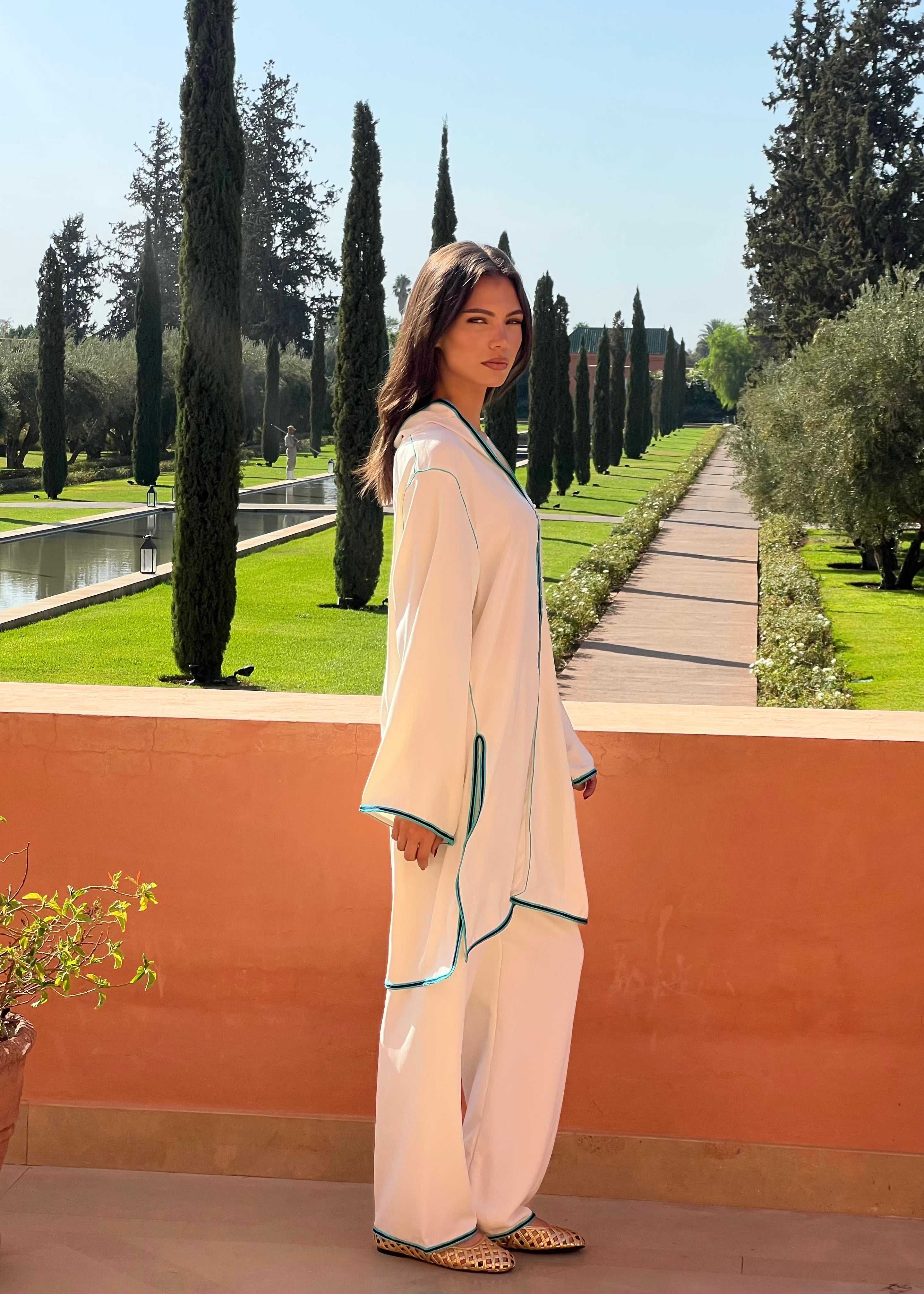 Tunic and pant set in white silk crepe with blue sfifa, fluid movement and natural fall of the fabric