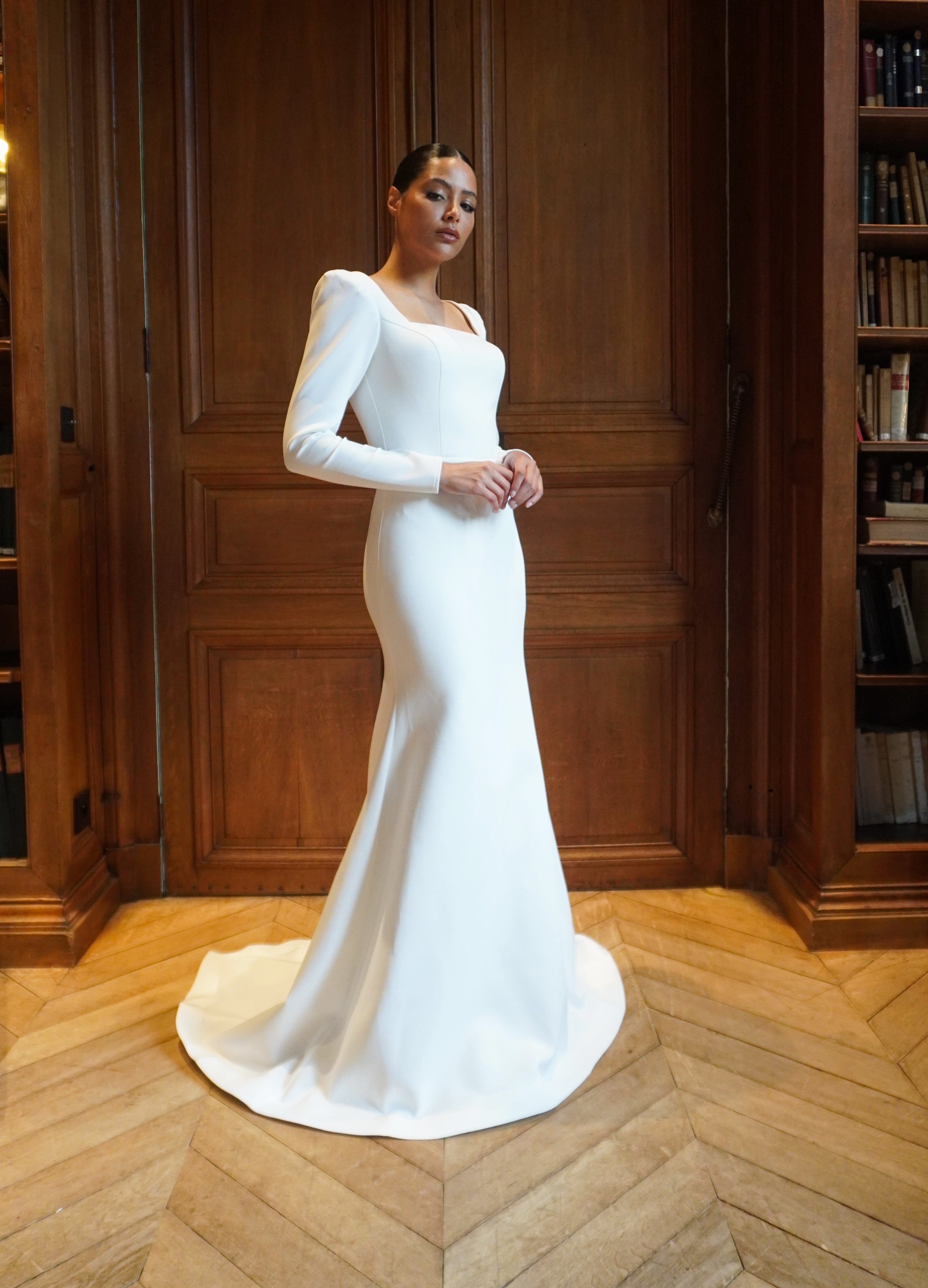 Long-sleeved wedding dress with elegant train - front view showing neckline and details
