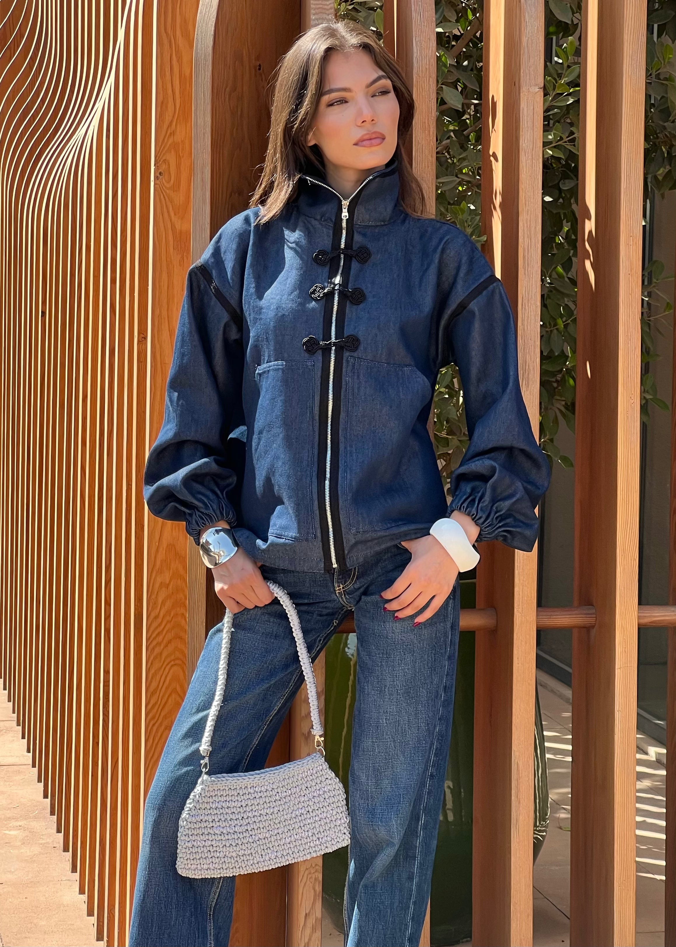 Denim jacket with black sfifa and Moroccan taîria in motion, chic urban style and traditional craftsmanship revisited