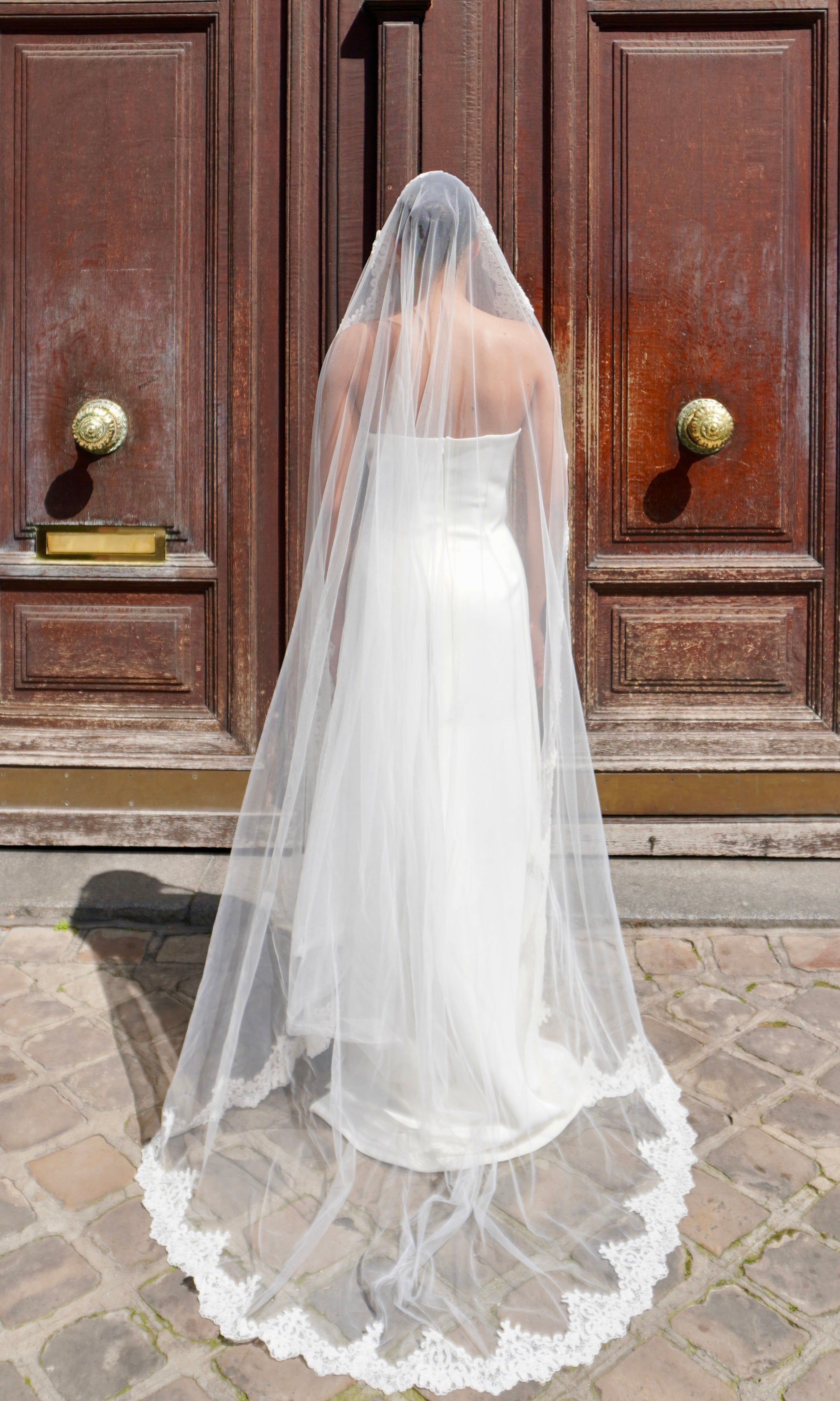 Bridal veil with refined lace trim - back view emphasizing the length and finish of the lace