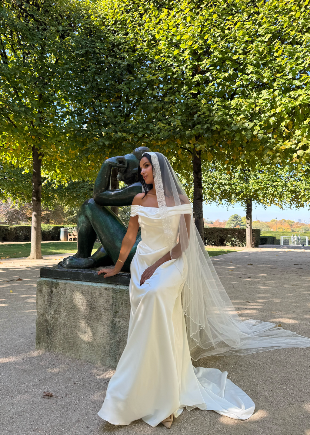 Side view of the beaded bridal veil, falling lightly and highlighted by a shimmering border.