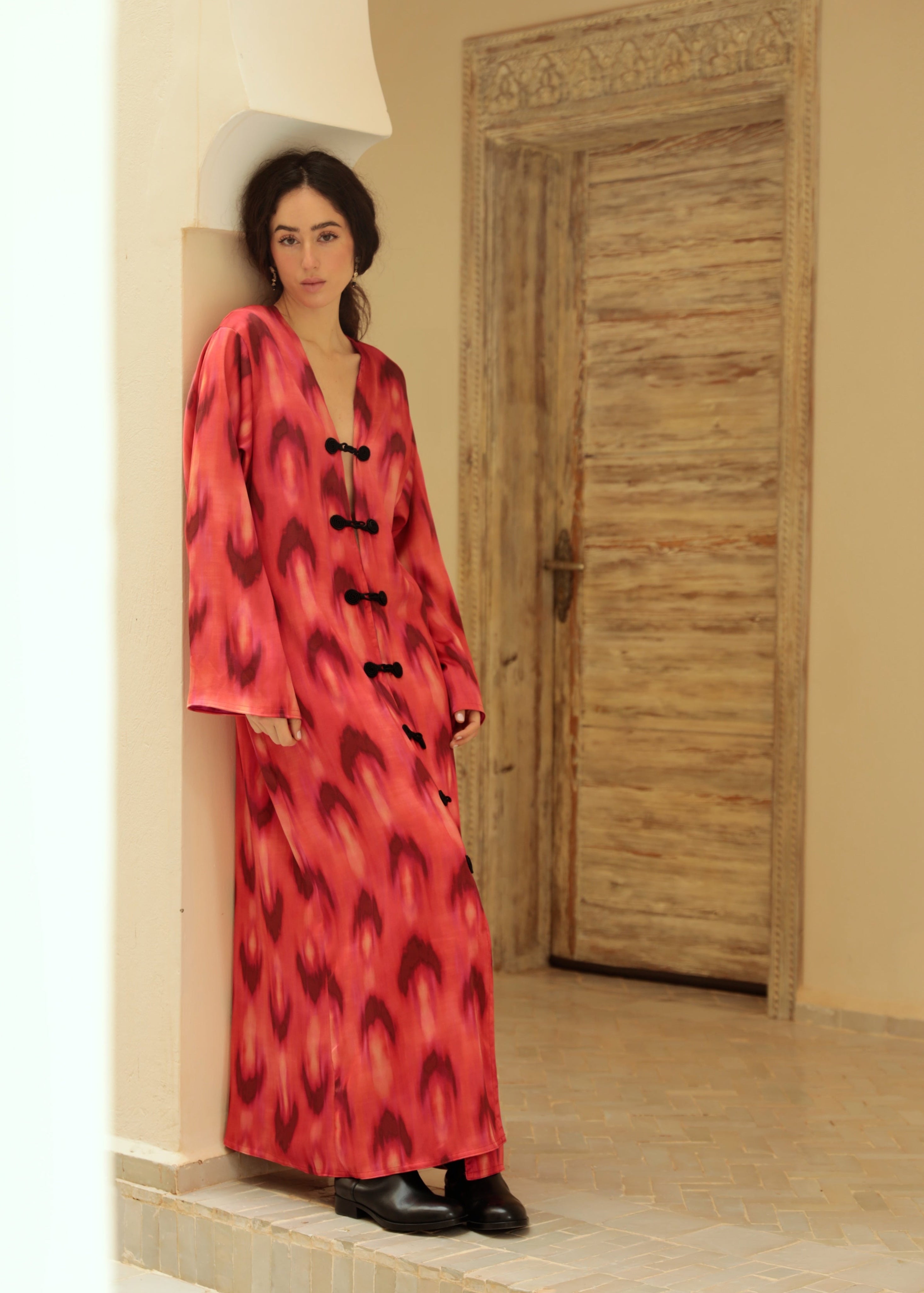 Red and black chiffon dress with crochet detailing, front view.