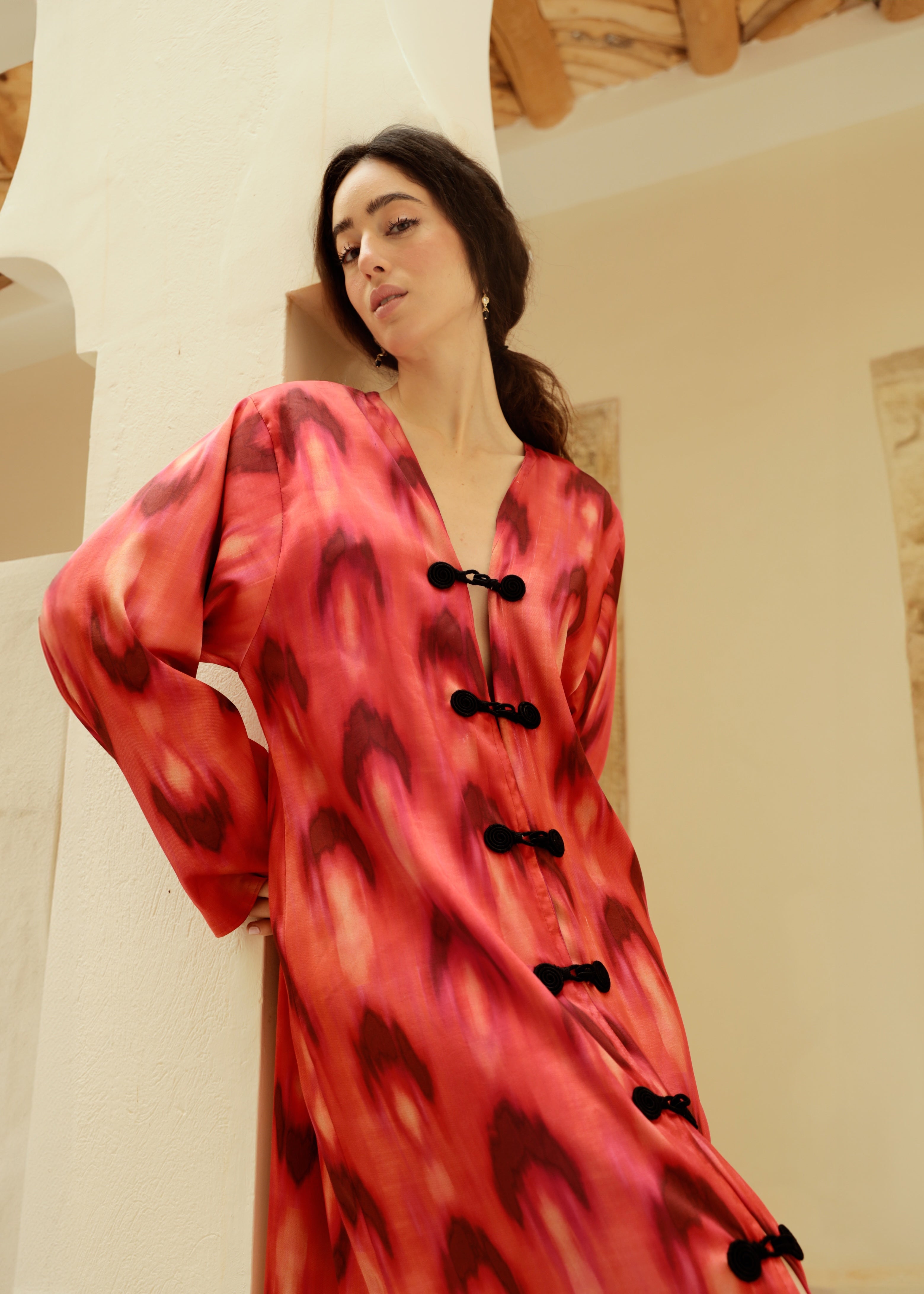 Red and black chiffon dress with crochet detailing, shown in motion.