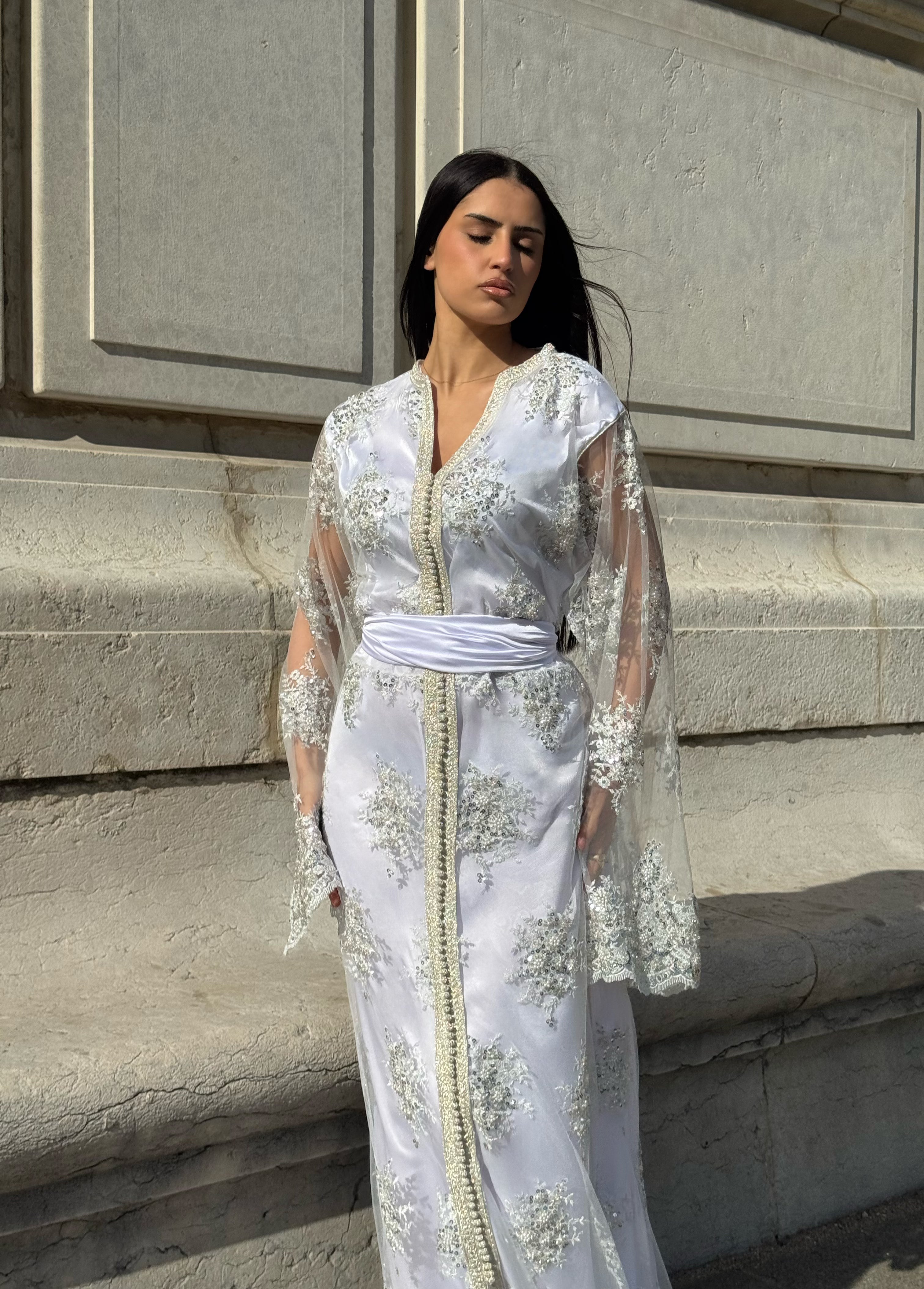 White Kaftan with silver embellishments and pearls, viewed from the front
