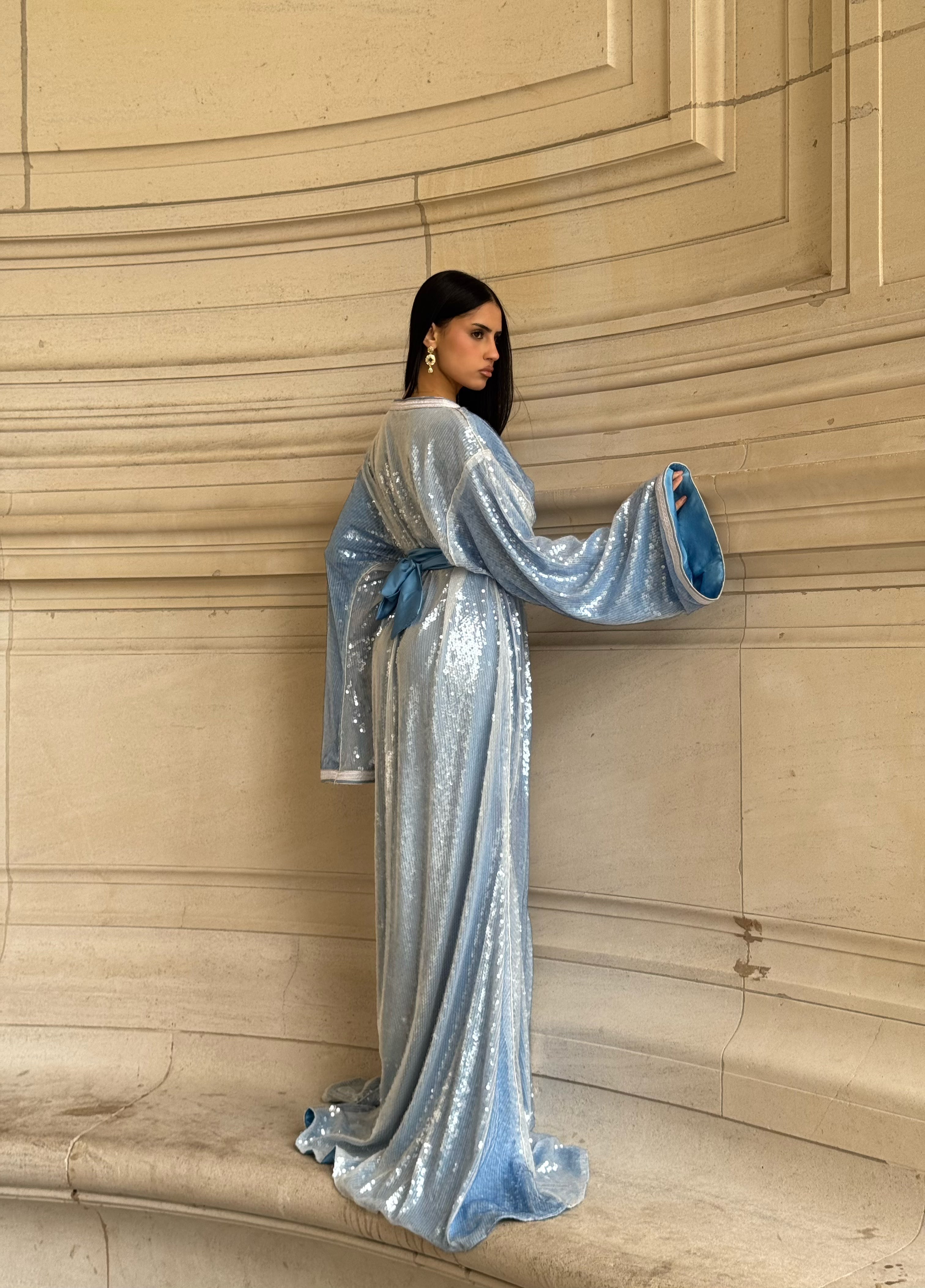 Worn Kaftan and white sequined Kaftan with a long, flowing, and elegant cut