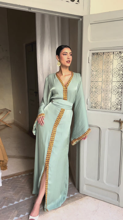 Front view video of the Kabyle dress in light green organza with wool belt. 