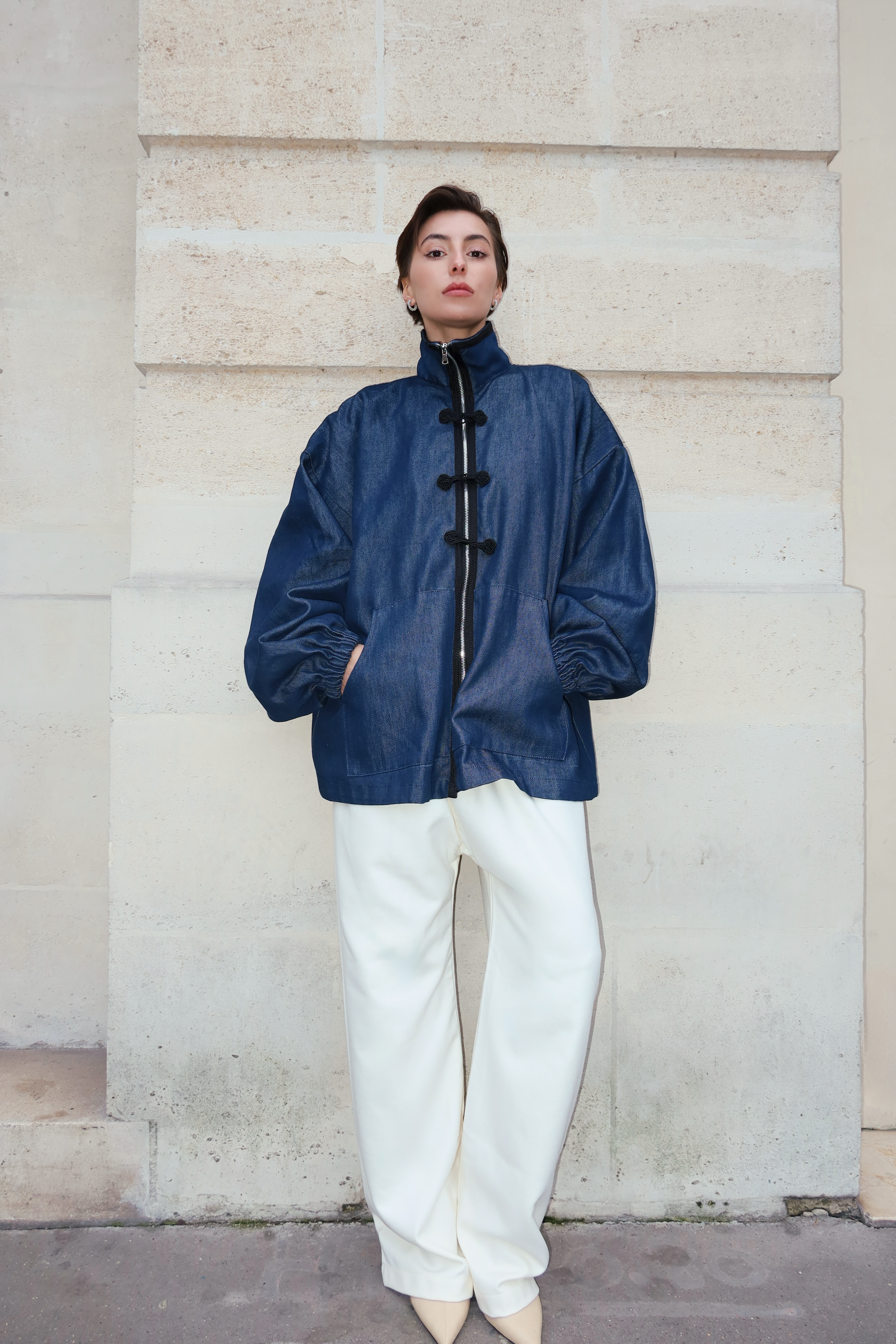 Denim jacket photographed full length, with zipper, black sfifa, and Moroccan taïria