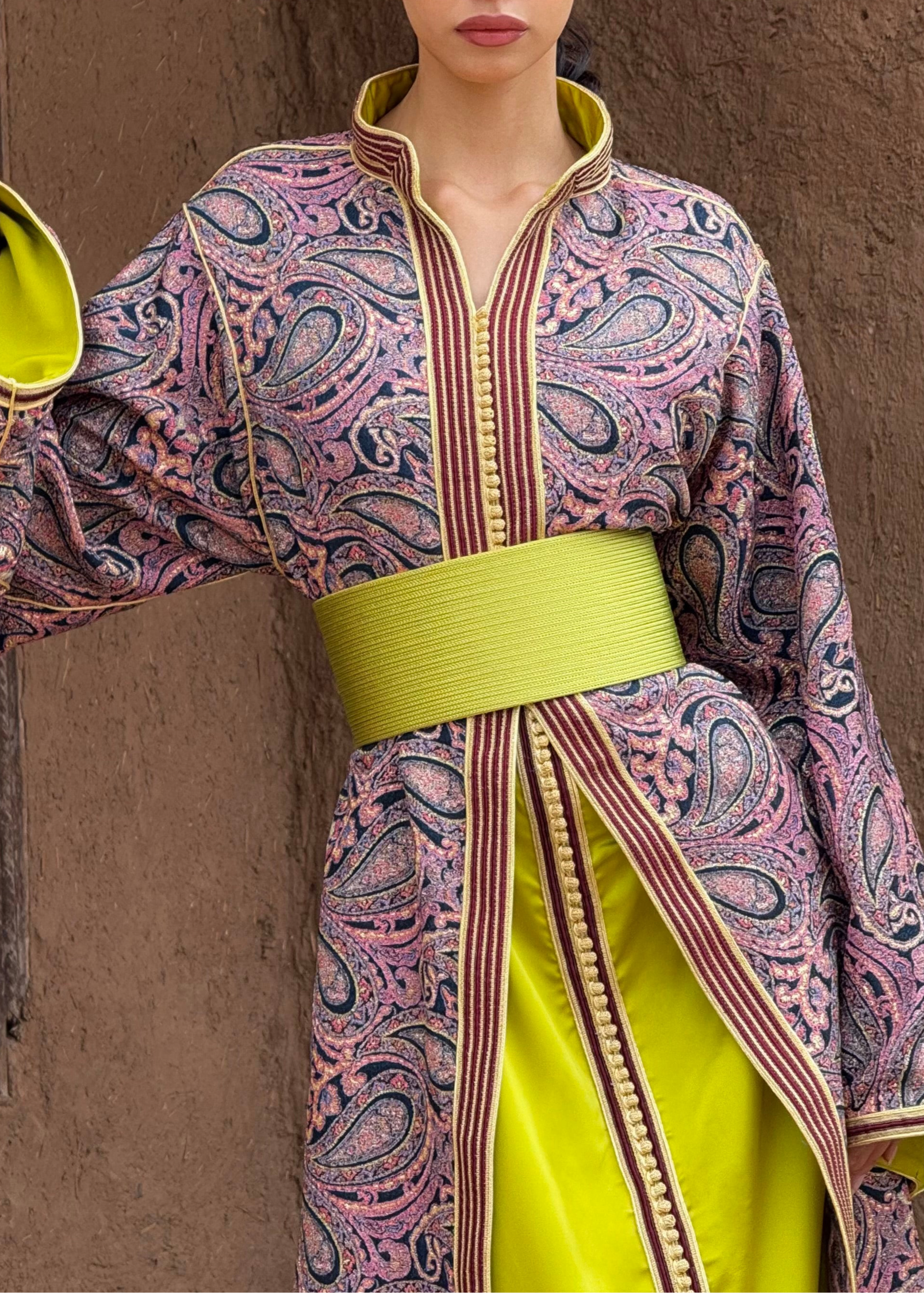 Zoom in on the details of the brocade Kaftan with burgundy and green collar, visible motifs and fabric.