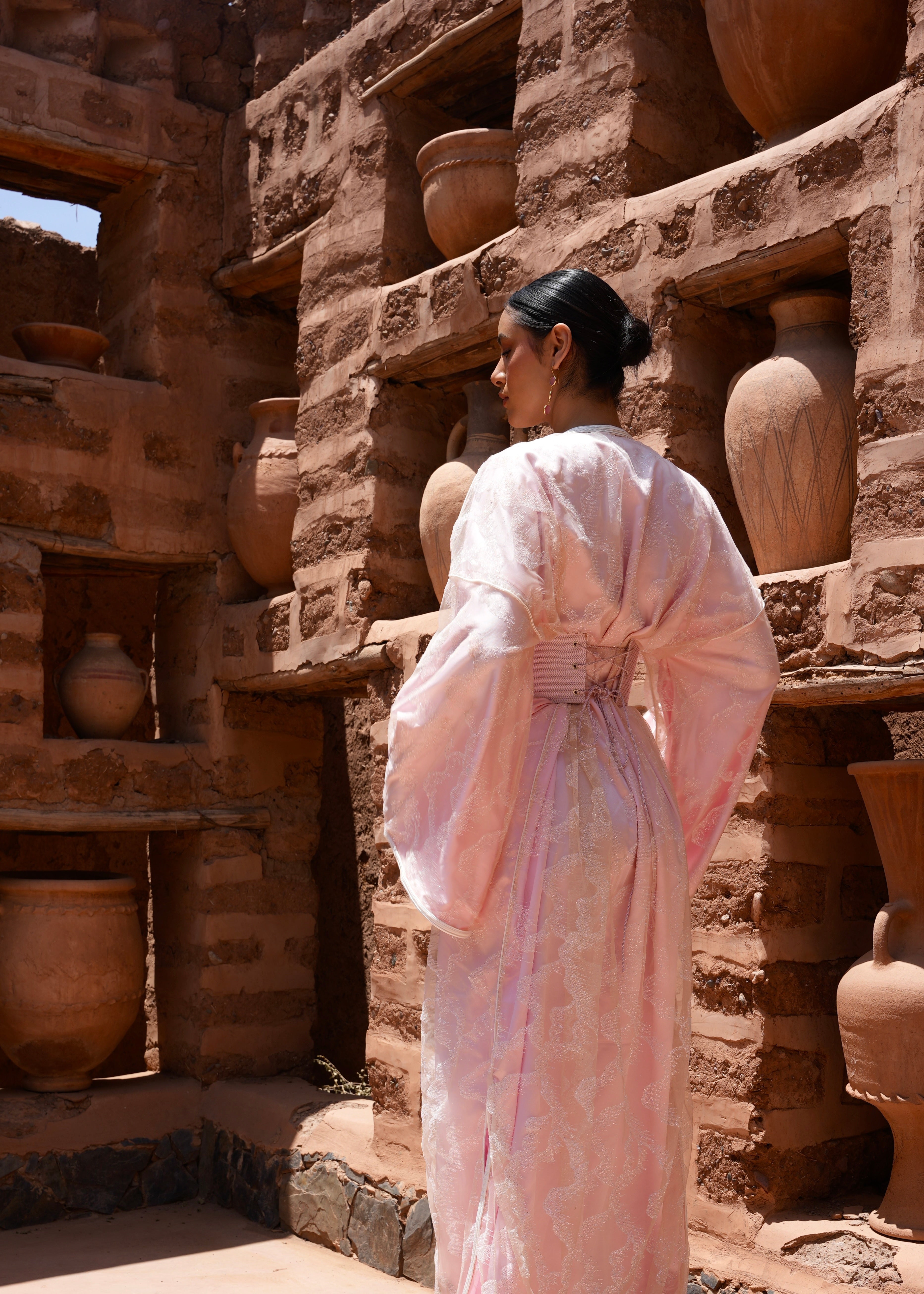 Back view of a pink Kaftan in sequined tulle, fluid cut and glittering details