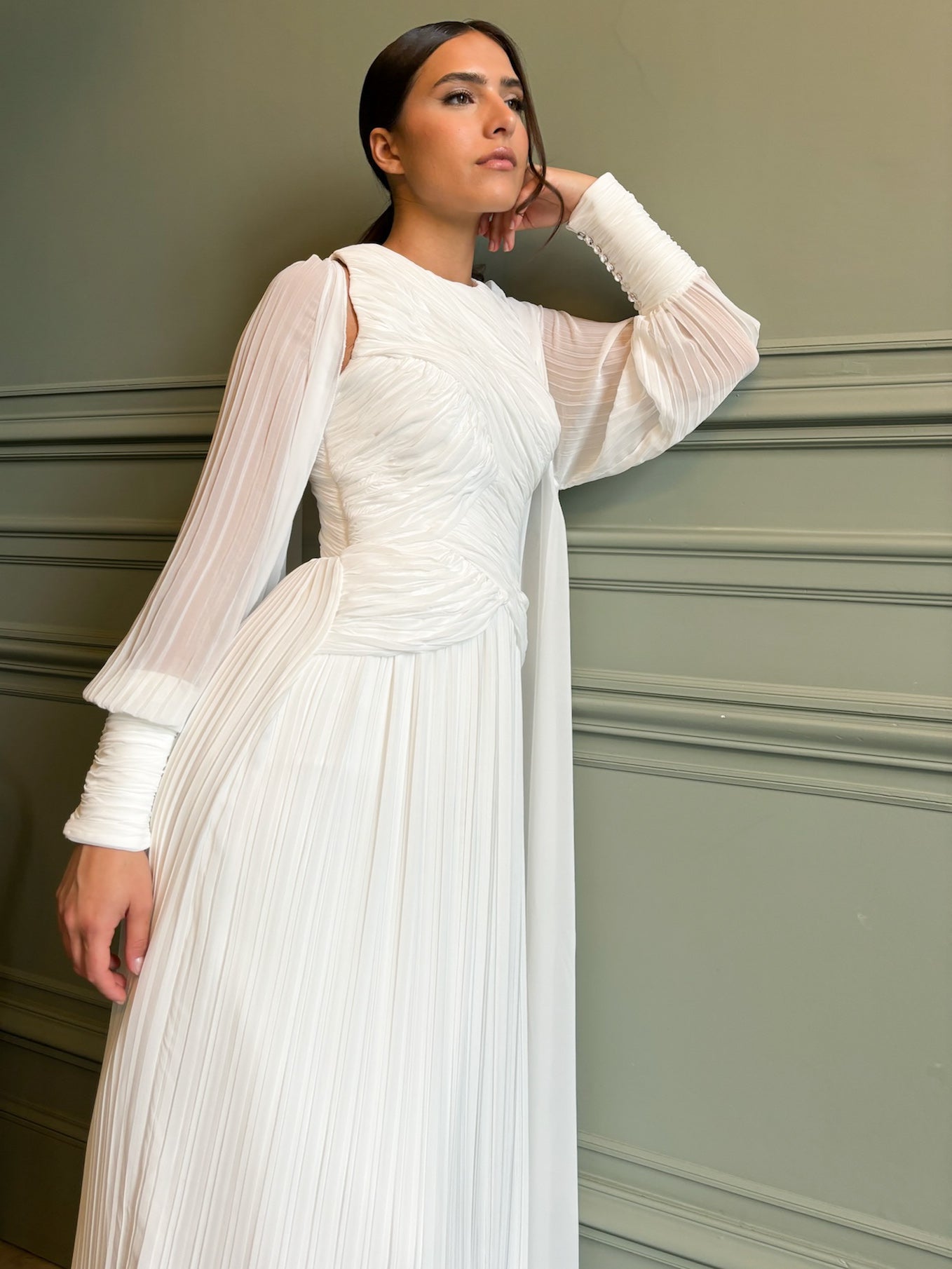 Close-up of the pleated tulle of the wedding cape, with fine details and an airy texture