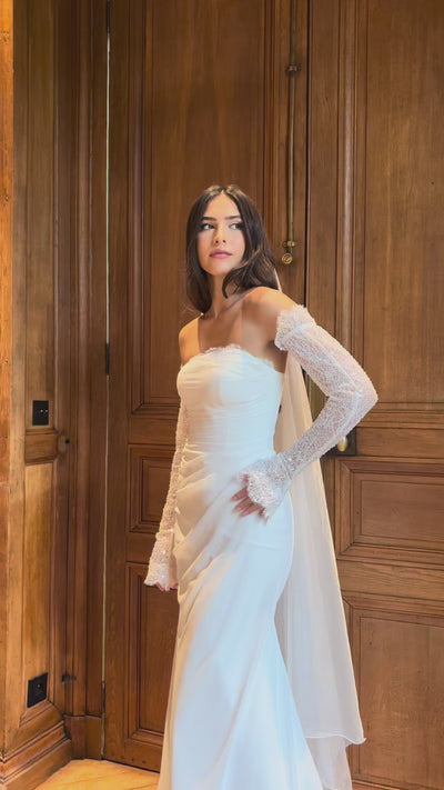 Video of draped strapless mermaid wedding gown with lace detail - moving view highlighting the elegant drape and delicate lace details