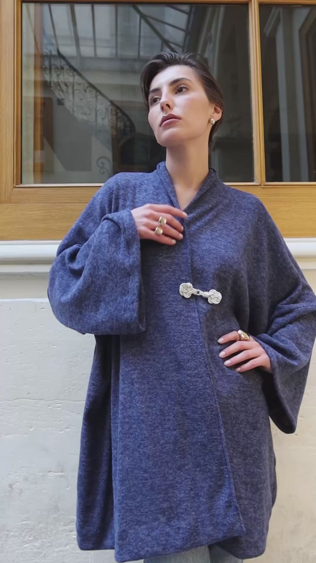 Video showing how to wear the blue wool cardigan with Moroccan crochet. 