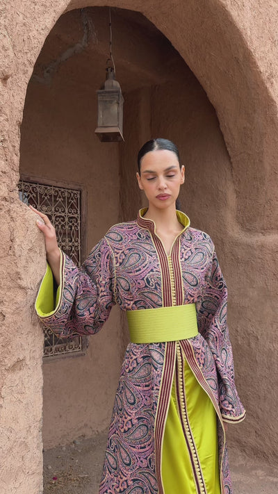 Global video showing the burgundy and green brocade collar Kaftan worn in motion