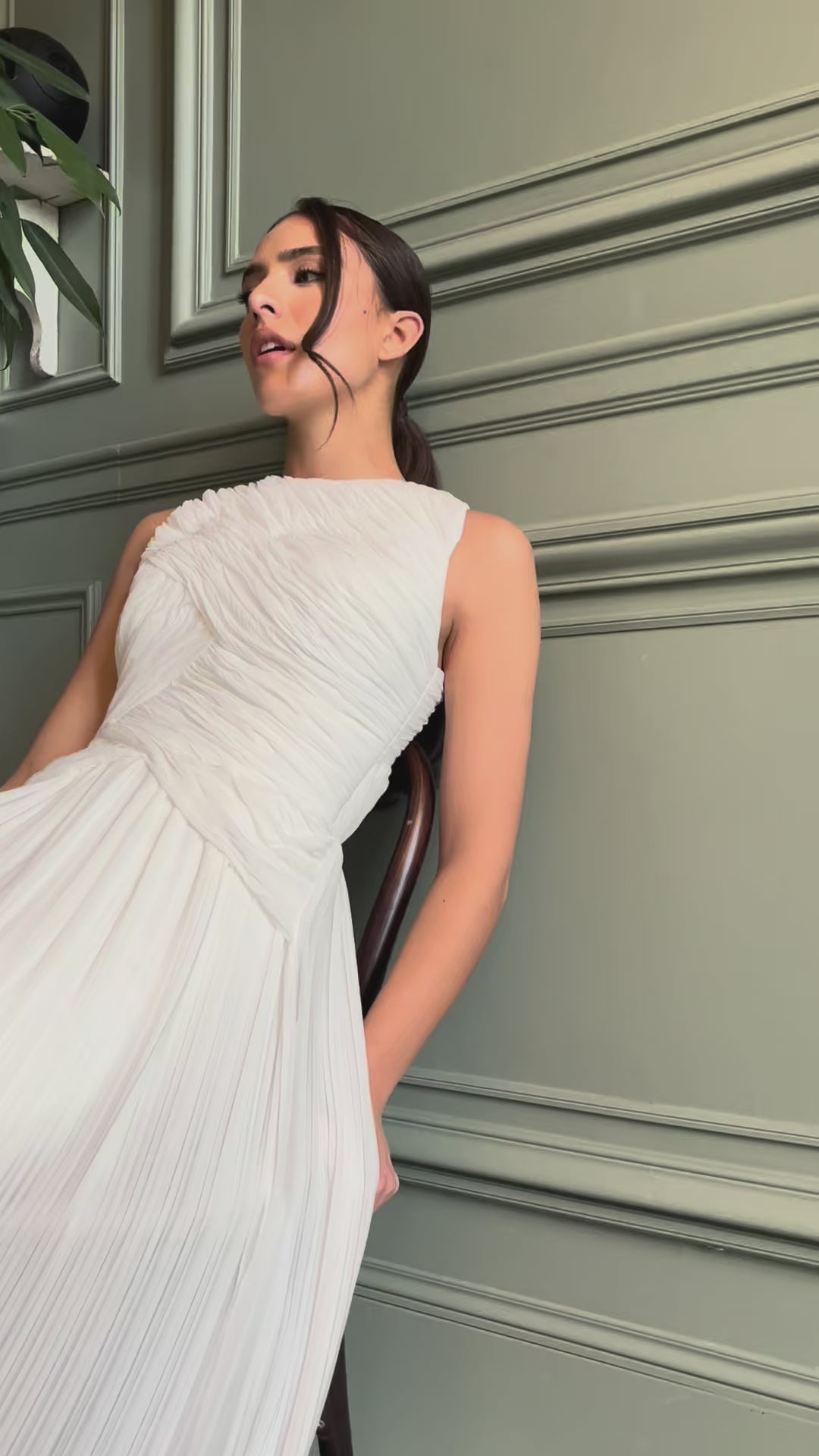 Video of the elegant and modern pleated wedding dress - moving view highlighting the delicate pleats and refined silhouette