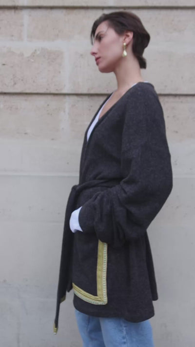 Video showing the dark gray wool vest with Moroccan sfifas. 