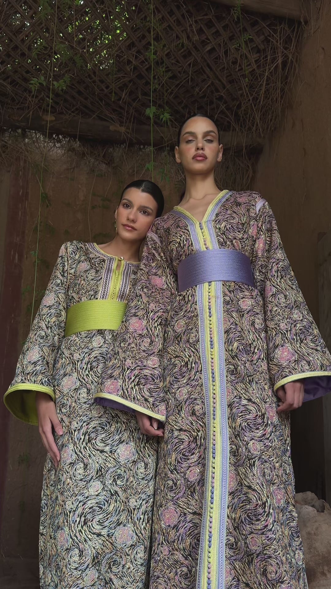 Video of the multicolored brocade Kaftan in motion, showing the purple and yellow details and the fluidity of the fabric.
