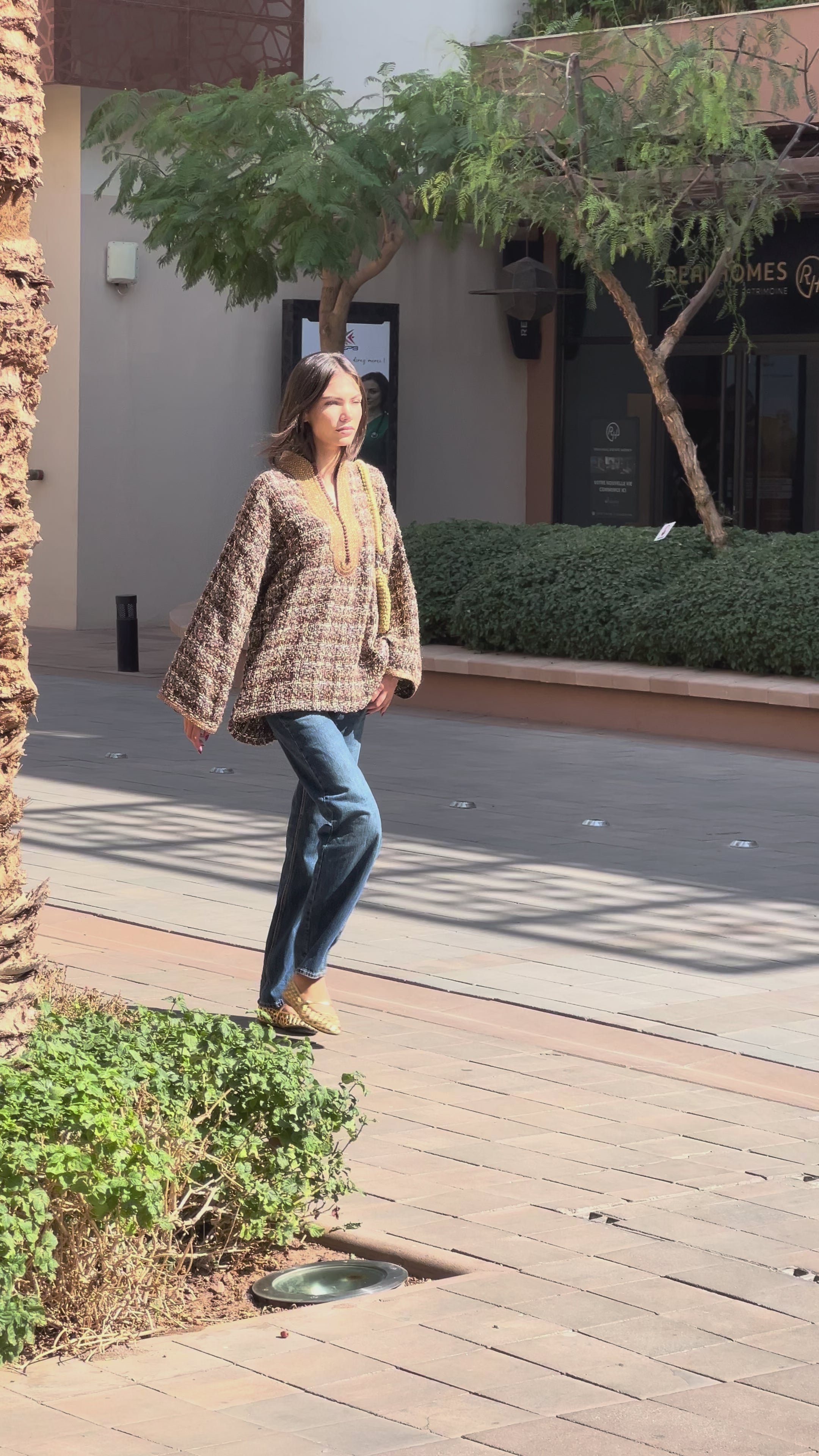 Brown tweed shirt with collar adorned with handcrafted sfifas. 