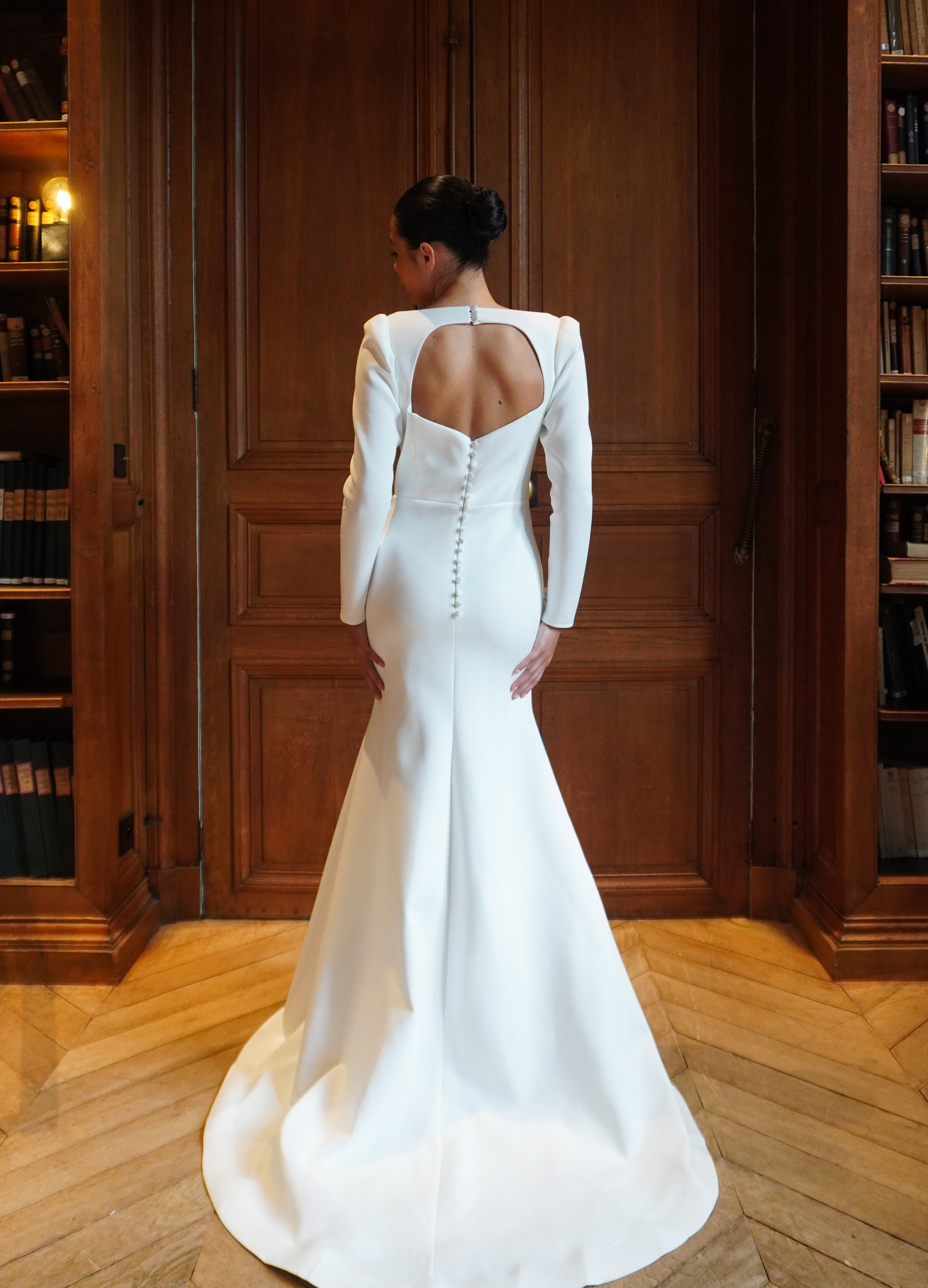 Long-sleeved wedding dress with elegant train - back view highlighting the train