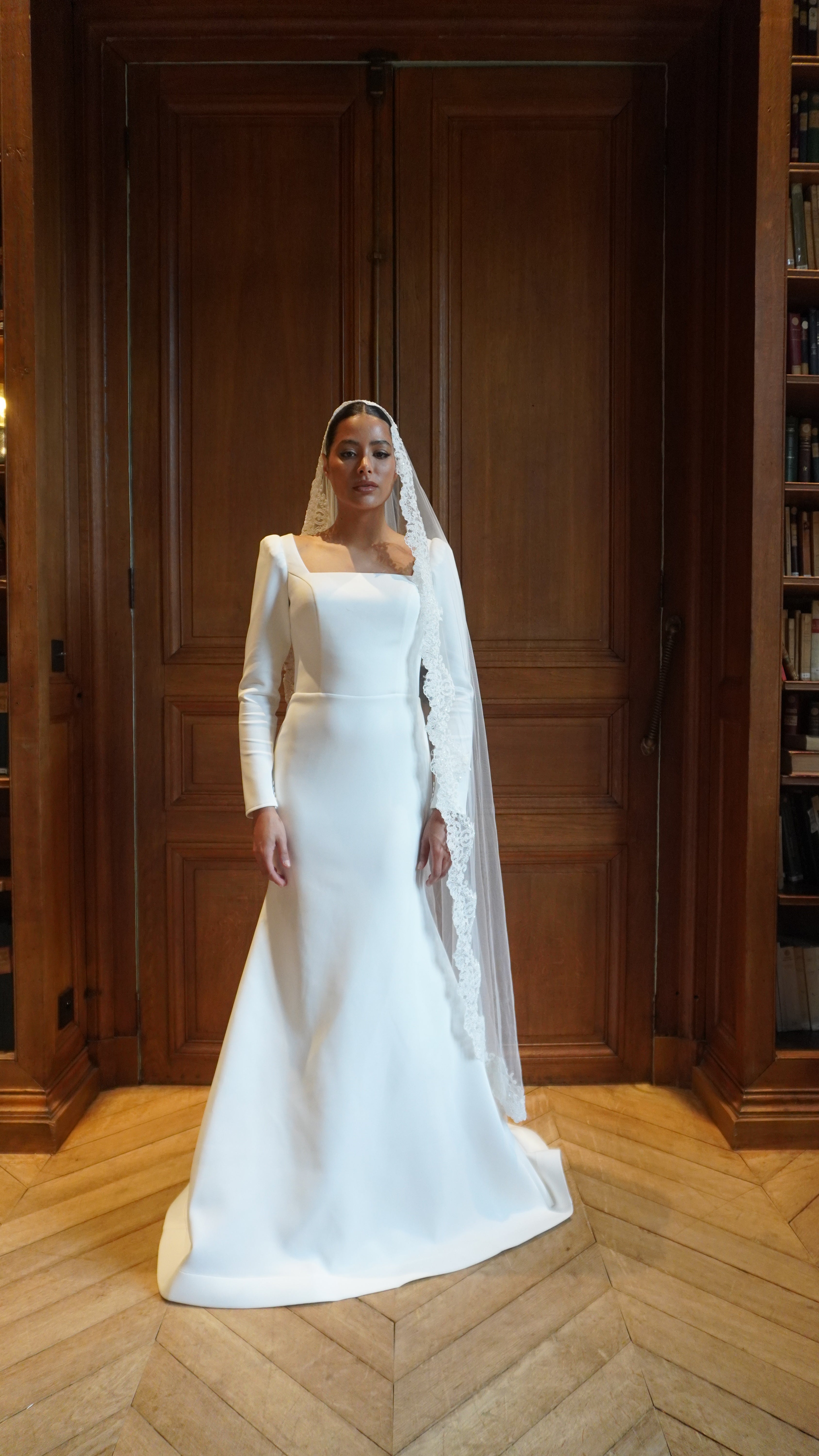 Long-sleeved wedding dress with elegant train - full silhouette view